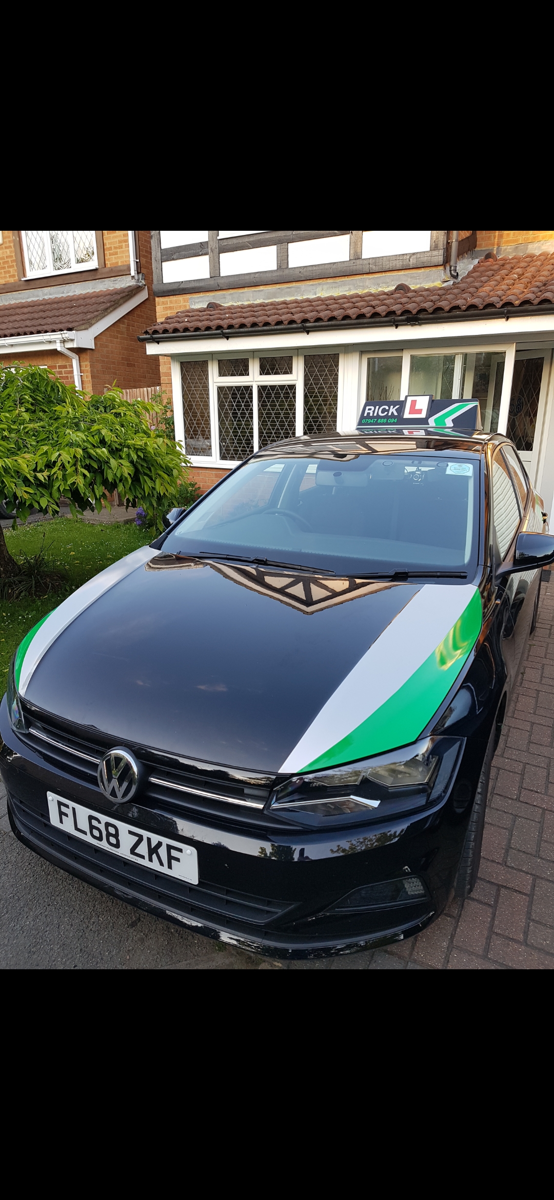 The front of Rick's Volkswagen learner car with its RICK roof sign